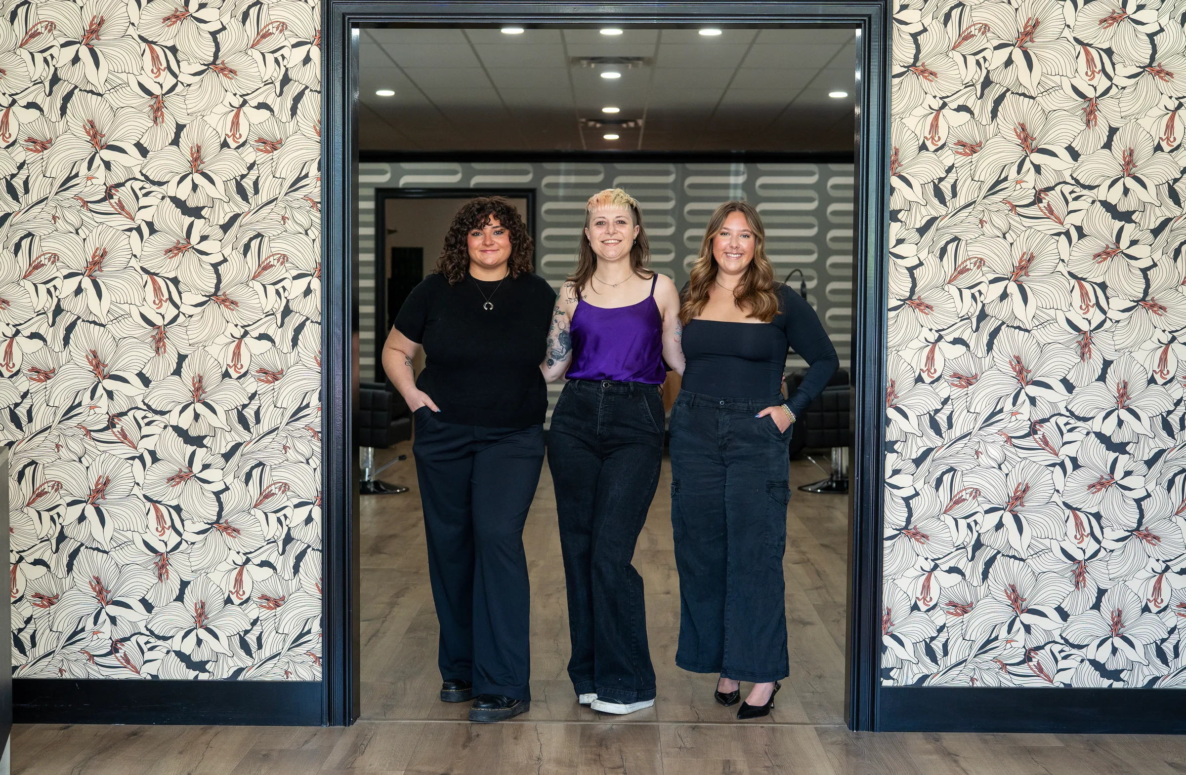 The Muse Hair Studio team standing in the salon in Powell, Ohio