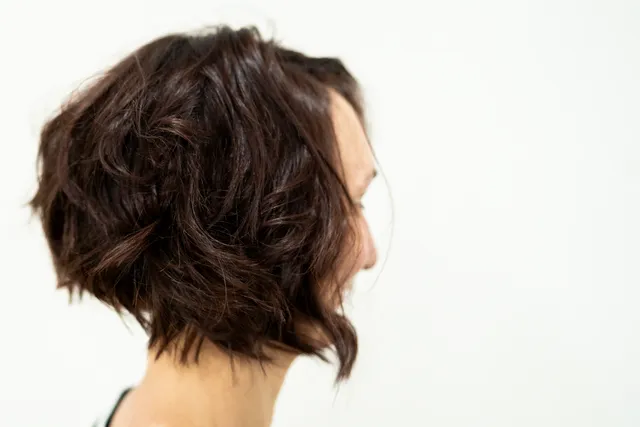 Textured layered haircut at Muse Hair Studio in Powell, Ohio - modern precision cutting with movement