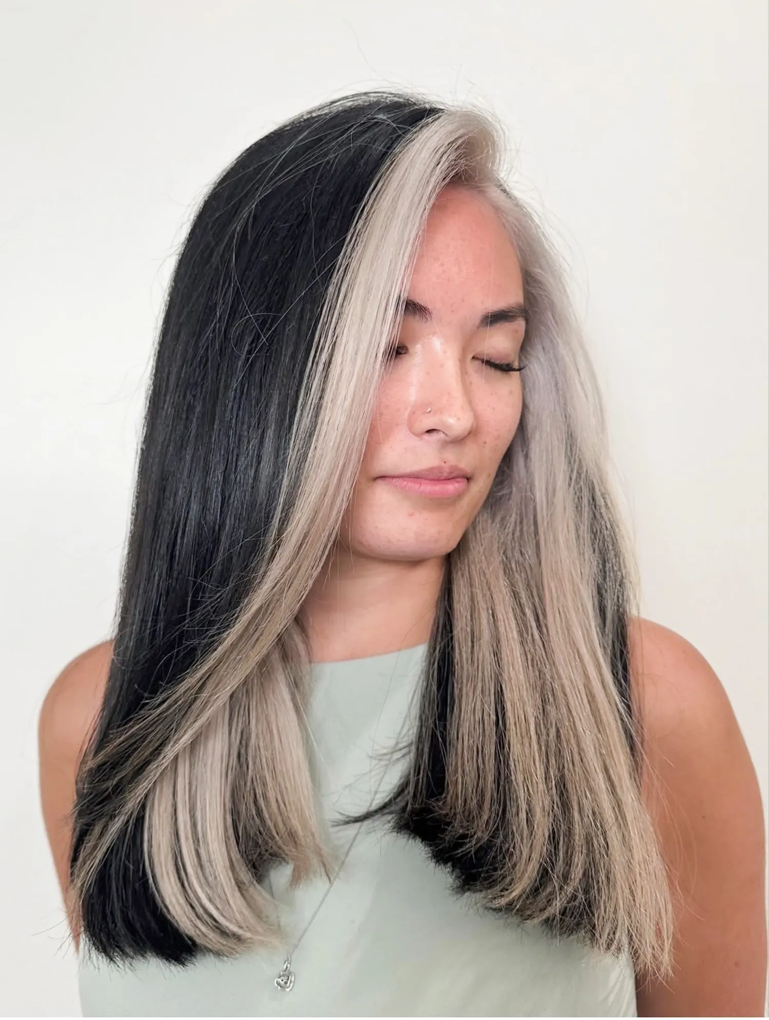 High-contrast black and platinum money piece at Muse Hair Studio in Powell, Ohio
